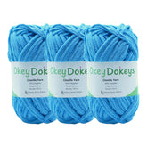 Three skeins of blue yarn with 'Okey Doke' labels on a white background
